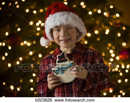 Stock Photograph - boy at christmas. Fotosearch