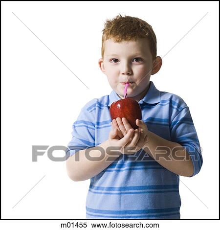 boy drinking an apple with a straw View Large Photo Image Stock Photography - boy drinking an apple with a straw. Fotosearch