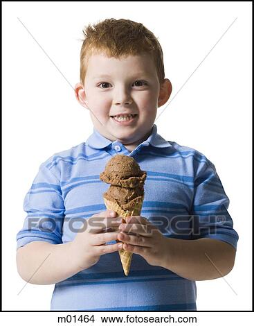 boy holding an ice cream cone View Large Photo Image Picture - boy holding an ice cream cone. Fotosearch
