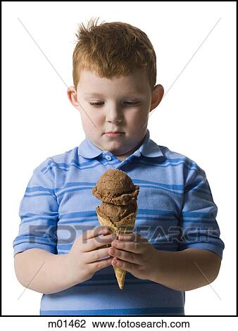 Stock Image - boy holding an ice cream cone. Fotosearch