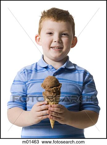 Stock Image - boy holding an ice cream cone. Fotosearch