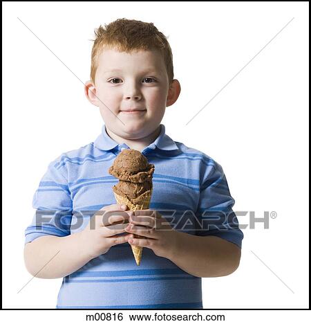 Stock Photograph - boy holding an ice cream cone. Fotosearch