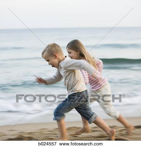 brother and sister running at the beach View Large Photo Image Stock Photo - brother and sister running at the beach. Fotosearch
