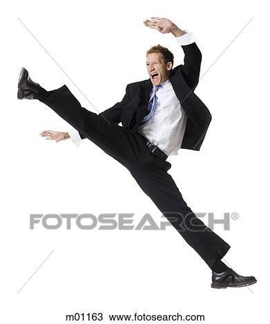 Stock Image - businessman doing a karate kick. Fotosearch