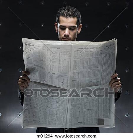 businessman holding a newspaper View Large Photo Image Picture - businessman holding a newspaper. Fotosearch