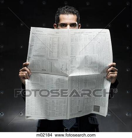 businessman holding a newspaper View Large Photo Image Picture - businessman holding a newspaper. Fotosearch