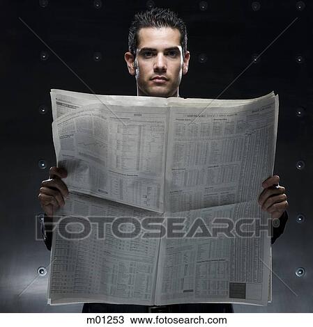 businessman holding a newspaper View Large Photo Image Stock Image - businessman holding a newspaper. Fotosearch