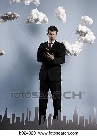 Stock Image - businessman taking notes. Fotosearch