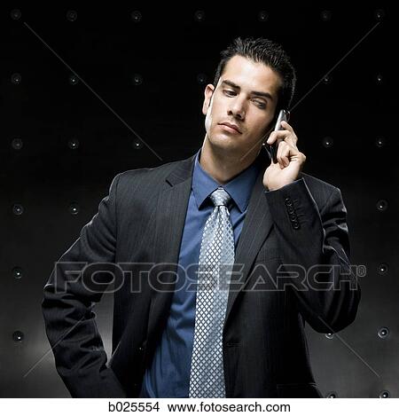 Picture - businessman using a cell phone. Fotosearch