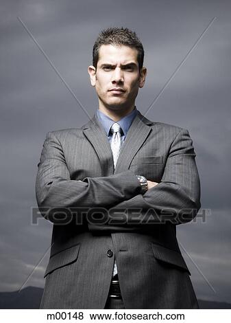 Stock Photo - businessman with arms folded. Fotosearch