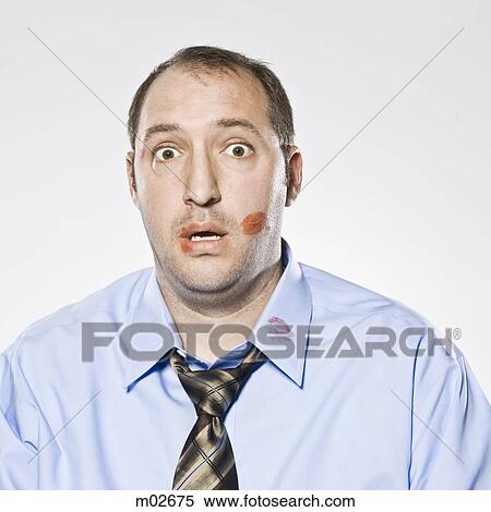 businessman with lipstick kiss marks all over his face View Large Photo Image Stock Photography - businessman with lipstick kiss marks all over his face. Fotosearch