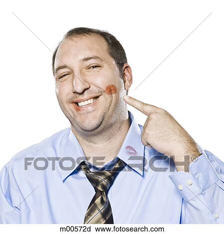 Stock Image - businessman with lipstick kisses on his shirt. Fotosearch