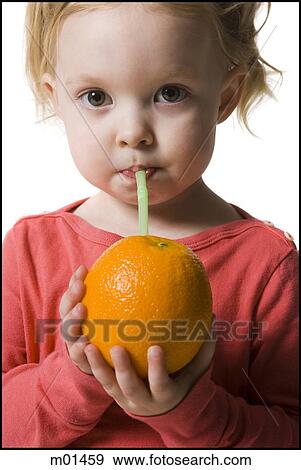 child drinking an orange with a straw in it View Large Photo Image Stock Photo - child drinking an orange with a straw in it. Fotosearch
