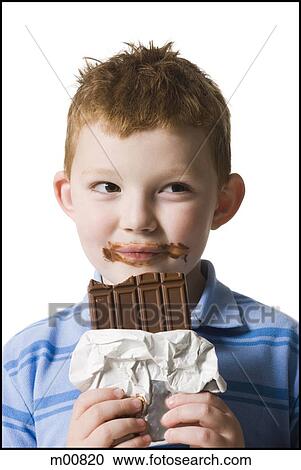 Stock Image - child eating chocolate. Fotosearch