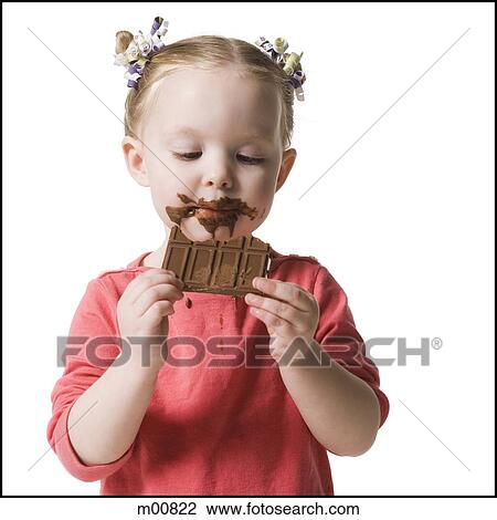 Stock Image - child eating chocolate. Fotosearch