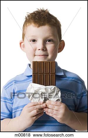 Stock Photo - child eating chocolate. Fotosearch