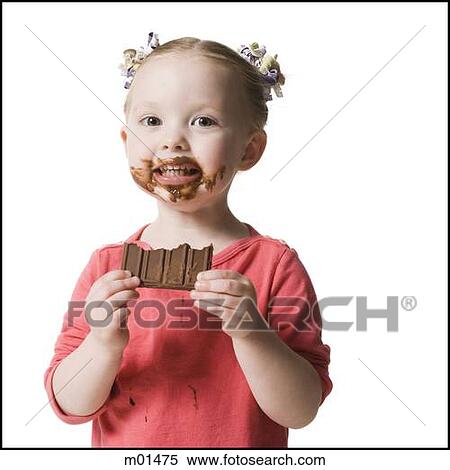 Stock Photography - child eating chocolate. Fotosearch