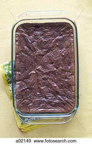Stock Photo - Chocolate cake in serving dish with napkins. Fotosearch