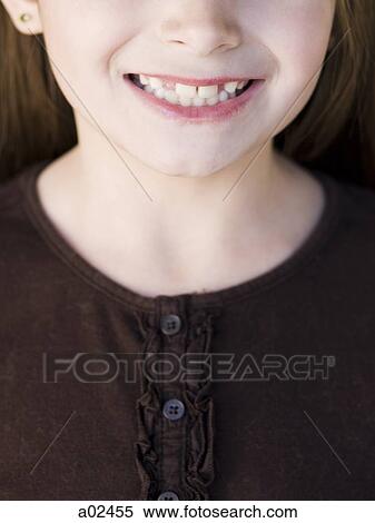 Close-up of girl (8-9) smiling View Large Photo Image Stock Photography - Close-up of girl (8-9) smiling. Fotosearch