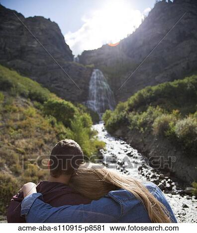 Couple by waterfall View Large Photo Image Stock Image - Couple by waterfall. Fotosearch