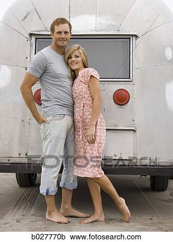 couple in front of their airstream classic trailer View Large Photo Image Stock Image - couple in front of their airstream classic trailer. Fotosearch