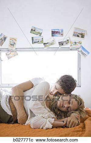 Stock Image - couple kissing inside a trailer. Fotosearch