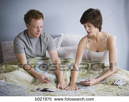 couple playing cards in bed View Large Photo Image Stock Photography - couple playing cards in bed. Fotosearch