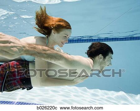 couple underwater View Large Photo Image Stock Image - couple underwater. Fotosearch