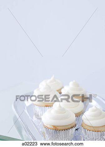 Cupcakes with frosting on silver tray, close-up, copy space View Large Photo Image Stock Image - Cupcakes with frosting on silver tray, close-up, copy space. Fotosearch