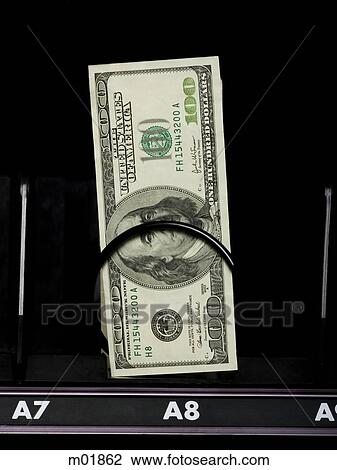 Stock Image - currency in a vending machine. Fotosearch