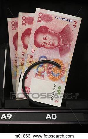 Stock Image - currency in a vending machine. Fotosearch