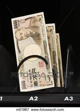 Stock Photo - currency in a vending machine. Fotosearch