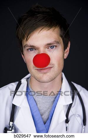 doctor wearing a red clown nose View Large Photo Image Stock Photo - doctor wearing a red clown nose. Fotosearch