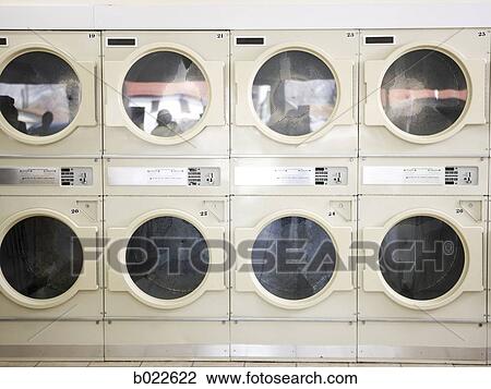 dryers in a laundromat View Large Photo Image Stock Image - dryers in a laundromat. Fotosearch