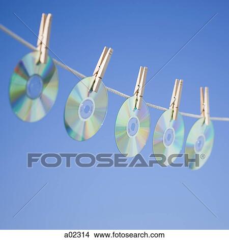 DVDs hanging on washing line View Large Photo Image Picture - DVDs hanging on washing line. Fotosearch