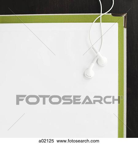 Earphones and blank paper on file View Large Photo Image Stock Photography - Earphones and blank paper on file. Fotosearch