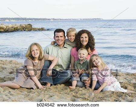 Stock Image - family at the beach. Fotosearch