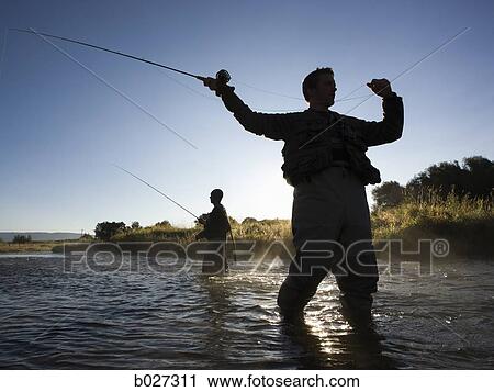 fly fisherman fishing in a mountain river View Large Photo Image Stock Image - fly fisherman fishing in a mountain river. Fotosearch