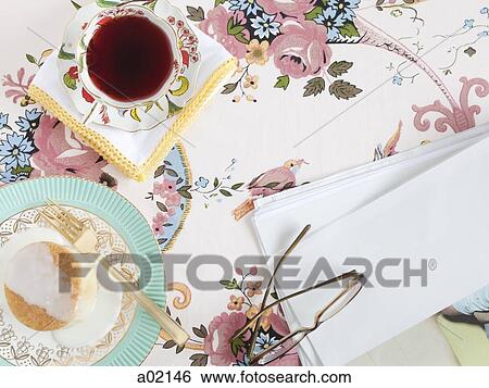 Food and drink with glasses and paper, on floral tablecloth View Large Photo Image Stock Photograph - Food and drink with glasses and paper, on floral tablecloth. Fotosearch