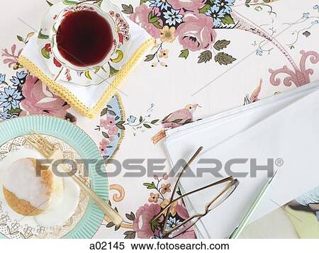 Food and drink with glasses and paper, on floral tablecloth View Large Photo Image Stock Photography - Food and drink with glasses and paper, on floral tablecloth. Fotosearch
