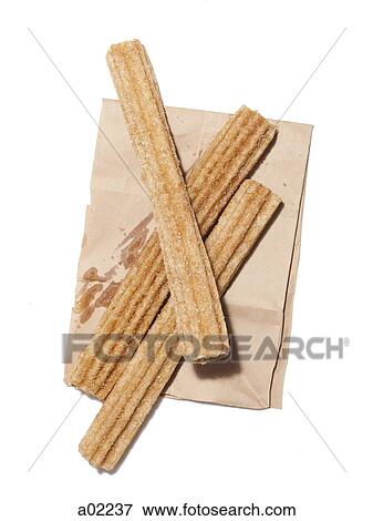 Fresh churros on paper bag, view from above, studio shot View Large Photo Image Stock Photo - Fresh churros on paper bag, view from above, studio shot. Fotosearch