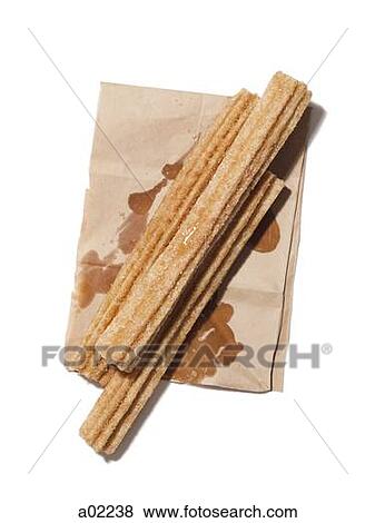 Fresh churros on paper bag, view from above, studio shot View Large Photo Image Stock Photo - Fresh churros on paper bag, view from above, studio shot. Fotosearch