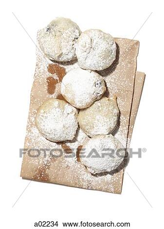 Freshly fried donuts with powdered sugar on paper bag, studio shot View Large Photo Image Picture - Freshly fried donuts with powdered sugar on paper bag, studio shot. Fotosearch
