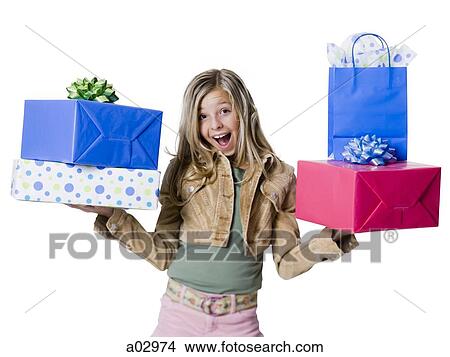Picture - Girl (10--11) standing with gifts, portrait. Fotosearch