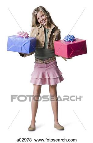 Girl (10--11) standing with gifts, portrait View Large Photo Image Stock Photo - Girl (10--11) standing with gifts, portrait. Fotosearch