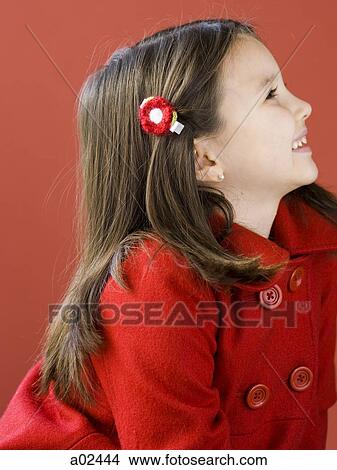 Girl (6-7) in red coat smiling, profile View Large Photo Image Picture - Girl (6-7) in red coat smiling, profile. Fotosearch