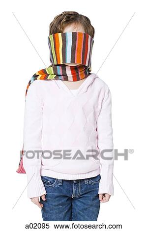 Stock Photography - Girl (6-7) with scarf covering face, studio shot. Fotosearch