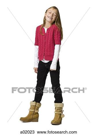 Stock Image - Girl (8-9) smiling, portrait, studio shot. Fotosearch