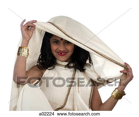 Girl (8-9) wearing traditional sari, smiling, portrait, studio-shot View Large Photo Image Picture - Girl (8-9) wearing traditional sari, smiling, portrait, studio-shot. Fotosearch
