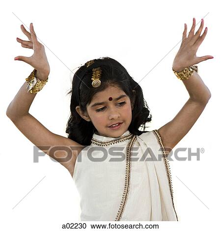Girl (8-9) wearing traditional sari performing figures from indian traditional dance, studio shot View Large Photo Image Stock Image - Girl (8-9) wearing traditional sari performing figures from indian traditional dance, studio shot. Fotosearch